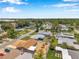An aerial view shows the home with mature trees and neighborhood at 6352 Canton S St, St Petersburg, FL 33712