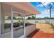 Expansive fenced backyard featuring a covered patio, low-maintenance gravel, and lush greenery at 6352 Canton S St, St Petersburg, FL 33712