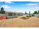 Large, fenced backyard with updated landscaping that features a covered patio and plenty of space at 6352 Canton S St, St Petersburg, FL 33712