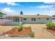 The landscaped backyard features decorative rock and low-maintenance gravel. A covered lanai enhances outdoor living at 6352 Canton S St, St Petersburg, FL 33712