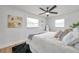 Stylish bedroom boasts a ceiling fan, area rug, and decorative art at 6352 Canton S St, St Petersburg, FL 33712