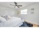 This bedroom features stylish decor, a ceiling fan, and plenty of natural light at 6352 Canton S St, St Petersburg, FL 33712