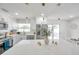 Bright kitchen features stainless appliances, pendant lighting, and a large center island with a marble countertop at 6352 Canton S St, St Petersburg, FL 33712