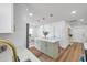 Open kitchen with marble countertops, stainless steel sink and stainless steel appliances at 6352 Canton S St, St Petersburg, FL 33712
