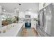 Bright, updated kitchen with stainless steel appliances and a view into the living room at 6352 Canton S St, St Petersburg, FL 33712