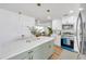 Renovated kitchen with stainless appliances, bright lighting and open floor plan at 6352 Canton S St, St Petersburg, FL 33712