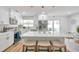 Bright, updated kitchen with stainless steel appliances, white cabinetry, and a large island with seating at 6352 Canton S St, St Petersburg, FL 33712