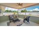 Relaxing covered patio featuring wicker furniture, ceiling fan, and stylish outdoor rug at 6352 Canton S St, St Petersburg, FL 33712
