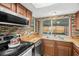 Kitchen featuring wooden countertops, a stainless steel sink, and modern stainless steel appliances at 6715 Ranchwood Loop, New Port Richey, FL 34653