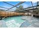 Sparkling pool featuring a screened enclosure, creating a relaxing outdoor retreat at 6715 Ranchwood Loop, New Port Richey, FL 34653