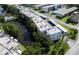 Aerial view highlighting property location near a pond at 7941 58Th N Ave # 301, St Petersburg, FL 33709