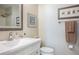 Bright bathroom featuring a vanity with sink, and a mirror above toilet and shower at 7941 58Th N Ave # 301, St Petersburg, FL 33709