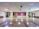 Large community hall with a stage and ample space for gatherings at 7941 58Th N Ave # 301, St Petersburg, FL 33709