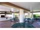 Community grill area with picnic tables under a covered space at 7941 58Th N Ave # 301, St Petersburg, FL 33709