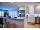 Contemporary kitchen featuring a breakfast bar, stainless steel refrigerator, white cabinets and lots of light at 7941 58Th N Ave # 301, St Petersburg, FL 33709