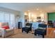 The condo's living room features a large island, a view to the kitchen, and comfortable seating at 7941 58Th N Ave # 301, St Petersburg, FL 33709