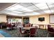 Community meeting room with tables, chairs, and entertainment center at 7941 58Th N Ave # 301, St Petersburg, FL 33709