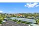 Aerial view of the community with tennis courts, pool, landscaping, and buildings at 7979 Sailboat Key S Blvd # 505, South Pasadena, FL 33707