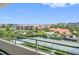 View of tennis courts, swimming pool, and community from the condo balcony at 7979 Sailboat Key S Blvd # 505, South Pasadena, FL 33707