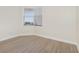 Bright and airy room with wood flooring, neutral walls, and a corner window offering natural light at 7979 Sailboat Key S Blvd # 505, South Pasadena, FL 33707