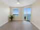 Bedroom with water views and plank flooring at 7979 Sailboat Key S Blvd # 505, South Pasadena, FL 33707