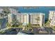 Exterior shot of condo building with bay view and parking at 7979 Sailboat Key S Blvd # 505, South Pasadena, FL 33707
