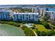 Stunning waterfront condo building with a swimming pool and gorgeous landscaping at 7979 Sailboat Key S Blvd # 505, South Pasadena, FL 33707