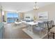 Open-concept living and dining area features stylish decor and breathtaking water views at 7979 Sailboat Key S Blvd # 505, South Pasadena, FL 33707