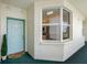 Charming condo entrance featuring a bright blue door, bay window, and tasteful landscaping for welcoming curb appeal at 7979 Sailboat Key S Blvd # 505, South Pasadena, FL 33707