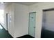 Hallway with elevator and access to the unit's storage locker at 7979 Sailboat Key S Blvd # 505, South Pasadena, FL 33707