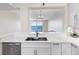 Modern kitchen featuring stainless steel appliances, quartz counters and open layout, ideal for cooking and entertaining at 7979 Sailboat Key S Blvd # 505, South Pasadena, FL 33707