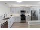 Modern kitchen with stainless appliances, granite countertops, and ample cabinet space for the home chef at 7979 Sailboat Key S Blvd # 505, South Pasadena, FL 33707