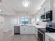 Bright kitchen features stainless steel appliances, tiled backsplash, and a seamless flow to the dining area at 7979 Sailboat Key S Blvd # 505, South Pasadena, FL 33707