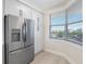 Bright, modern kitchen with stainless steel fridge, ample cabinet space and adjacent window offering a beautiful view at 7979 Sailboat Key S Blvd # 505, South Pasadena, FL 33707