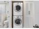 Convenient stackable washer and dryer set with a louvered closet next to the bathroom at 7979 Sailboat Key S Blvd # 505, South Pasadena, FL 33707