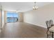 Bright and airy living room area with an open concept design and sliding door access to the balcony at 7979 Sailboat Key S Blvd # 505, South Pasadena, FL 33707