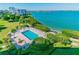 Beautiful pool area next to the ocean with plenty of seating for residents to relax and enjoy the sun at 7979 Sailboat Key S Blvd # 505, South Pasadena, FL 33707