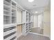 Bright, well-organized walk-in closet with custom shelving, drawers, and ample storage space at 7979 Sailboat Key S Blvd # 505, South Pasadena, FL 33707