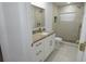 Bright bathroom features granite countertops, white cabinets, and a stand-up shower at 814 W 131St Ave, Tampa, FL 33612