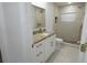 Bathroom with tiled shower, granite counters and golden hardware at 814 W 131St Ave, Tampa, FL 33612
