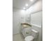 Bright bathroom features granite countertops, white cabinets, and gold hardware at 814 W 131St Ave, Tampa, FL 33612