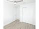 Bedroom with light-colored wood floors, a ceiling fan, and white trim at 814 W 131St Ave, Tampa, FL 33612