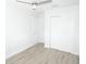 Clean bedroom features wood-look flooring, fresh paint, and a closet at 814 W 131St Ave, Tampa, FL 33612