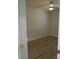Small bedroom with light-colored wood floors, a ceiling fan, and white walls at 814 W 131St Ave, Tampa, FL 33612