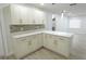 Updated kitchen featuring stainless steel appliances, stylish cabinetry, and quartz countertops at 814 W 131St Ave, Tampa, FL 33612