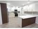 Beautiful kitchen with stainless steel appliances, custom cabinets, quartz countertops, and decorative backsplash at 814 W 131St Ave, Tampa, FL 33612