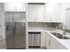 Updated kitchen featuring stainless steel appliances, stylish cabinetry, quartz countertops, and modern fixtures at 814 W 131St Ave, Tampa, FL 33612