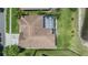 Aerial view highlighting a roof, screened in pool, and lush lawn in a private backyard at 9126 Cypress Keep Ln, Odessa, FL 33556