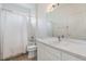 Clean bathroom with white vanity, sink, toilet, and shower with curtain at 9126 Cypress Keep Ln, Odessa, FL 33556