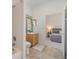 Bathroom featuring tile flooring and a view into an adjacent bedroom at 9126 Cypress Keep Ln, Odessa, FL 33556